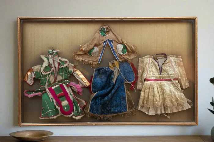 Framed Collection of Antique Children’s Robes